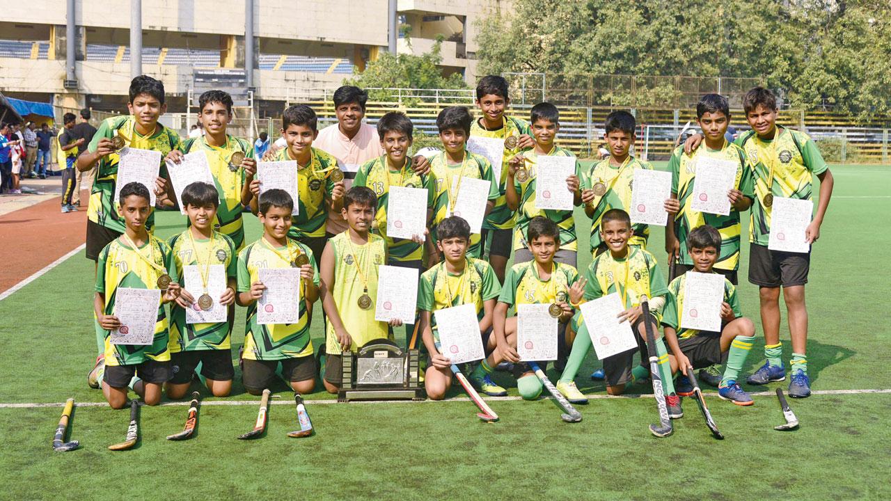 Boys U-14 winners St Stanislaus (Bandra) with their trophy yesterday. Pics/Atul Kamble