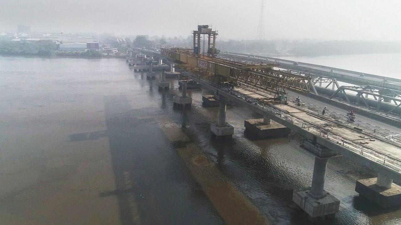 Construction on the 550-meter-long bridge for Orange line 5 over the  creek at Kasheli