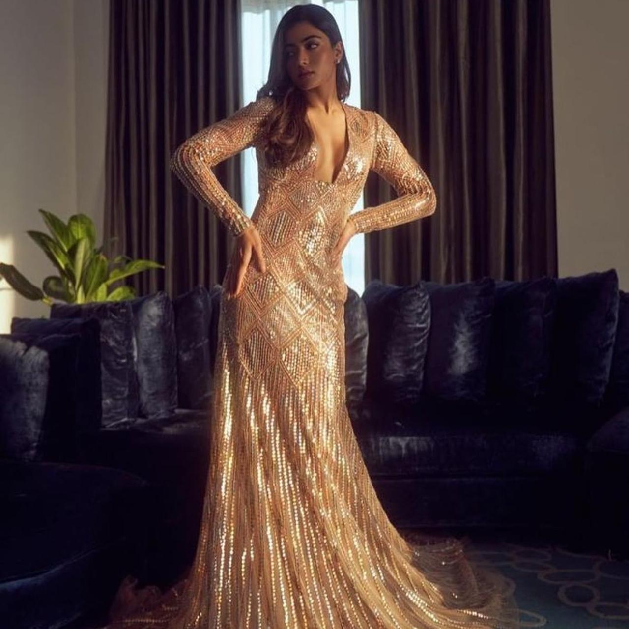 Rashmika Mandanna has been shining bright with her work and has also been acing her fashion game. The actress looked stunning in this gold gown that perfectly fits her curves