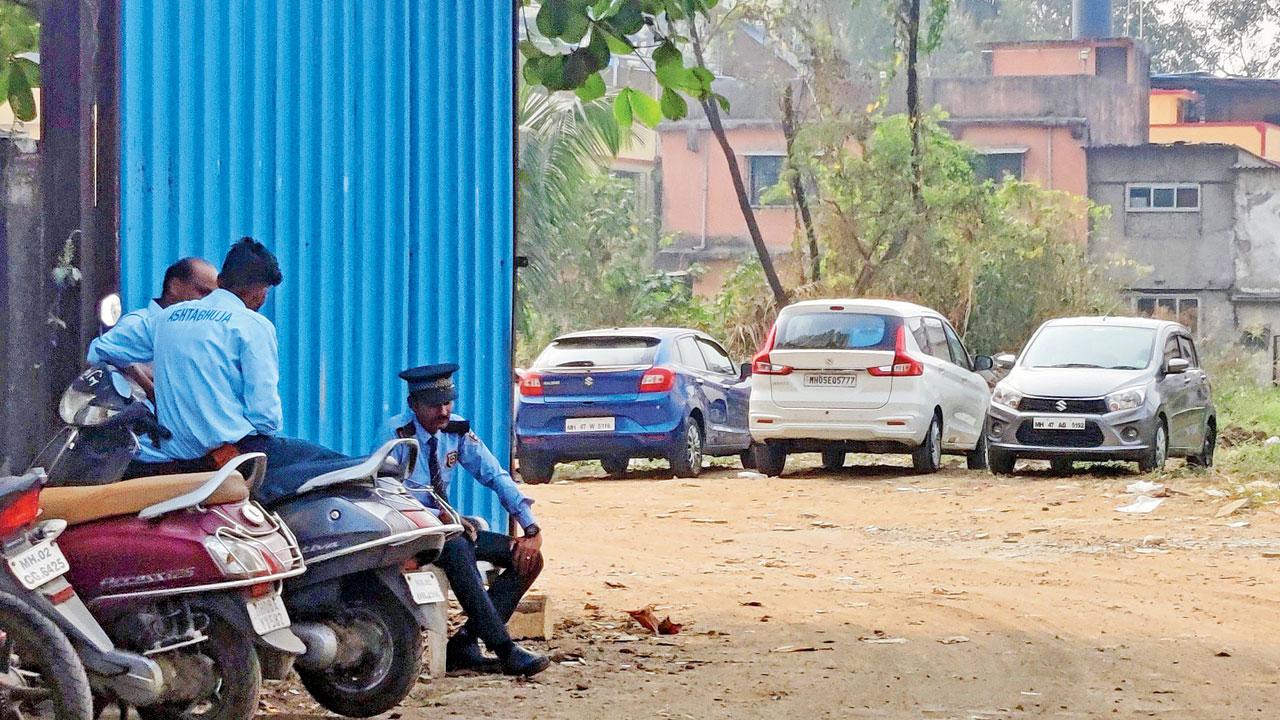 Security guard and valet posted by the school near the gate of the ground. Pics/Nimesh Dave