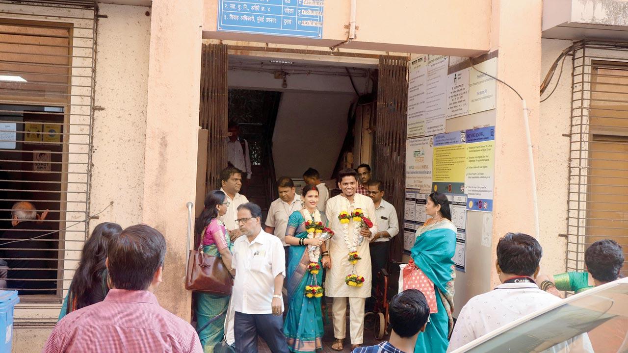 A newlywed couple exits the Magistrate’s office after offline registration, in Khar on Friday. Pic/Anurag Ahire