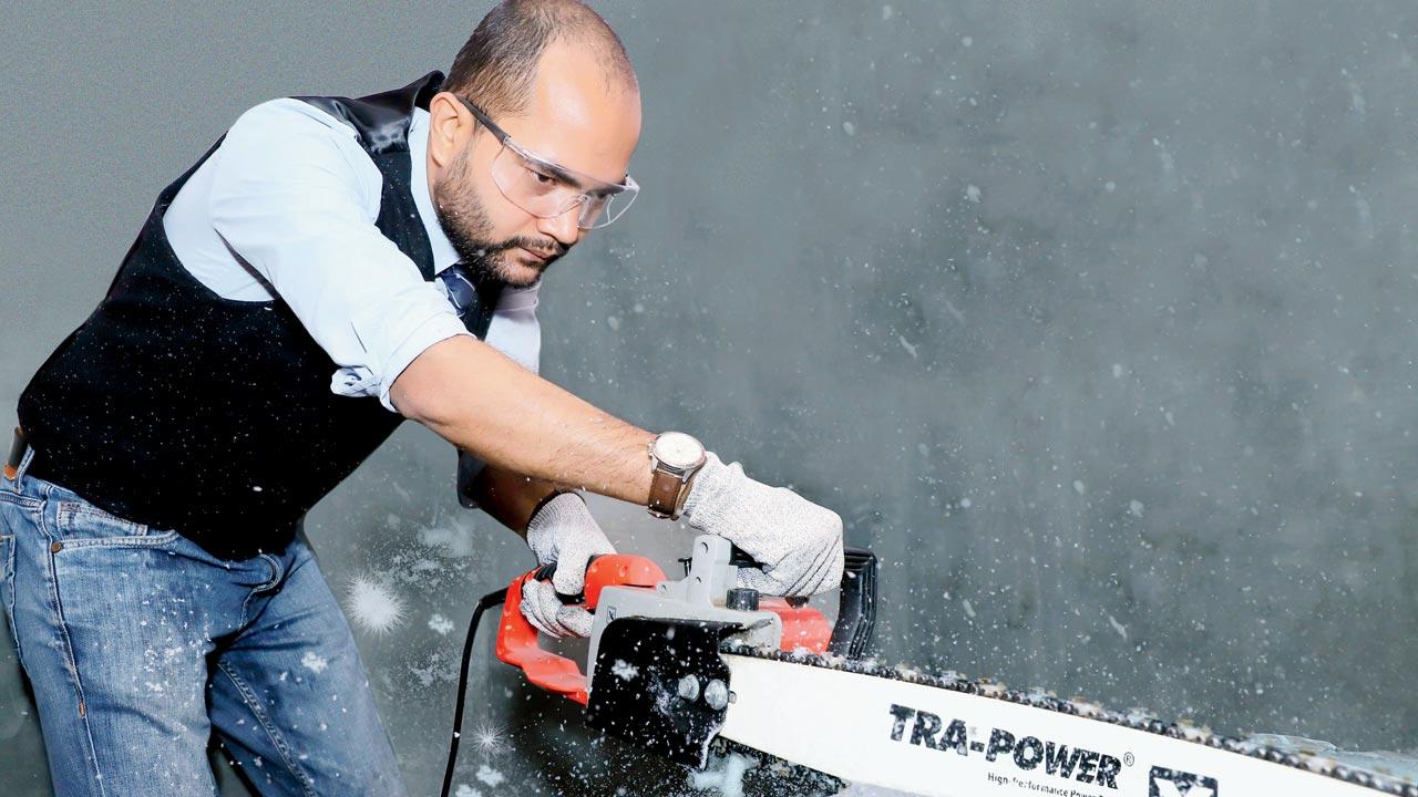 Annu Kumar, founder of JUSTice, uses machines like chainsaw to cut slabs of ice into smaller blocks