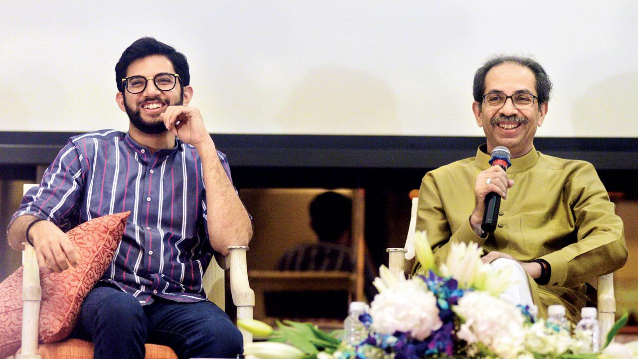 Uddhav Thackeray, seen here with (left)  Aaditya, held a meeting of former corporators at his residence Matoshree, regarding the Senate election. Pic/Rane Ashish