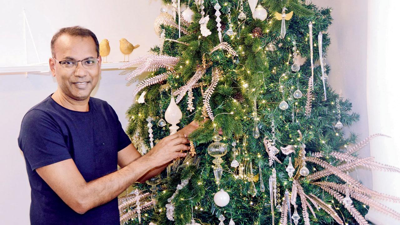 Fr Warner D’Souza chopped off the low lying branches of a Christmas tree, dried them for three weeks, painted them in gold and placed these between the branches of his tree. PICS/ SAYYED SAMEER ABEDI