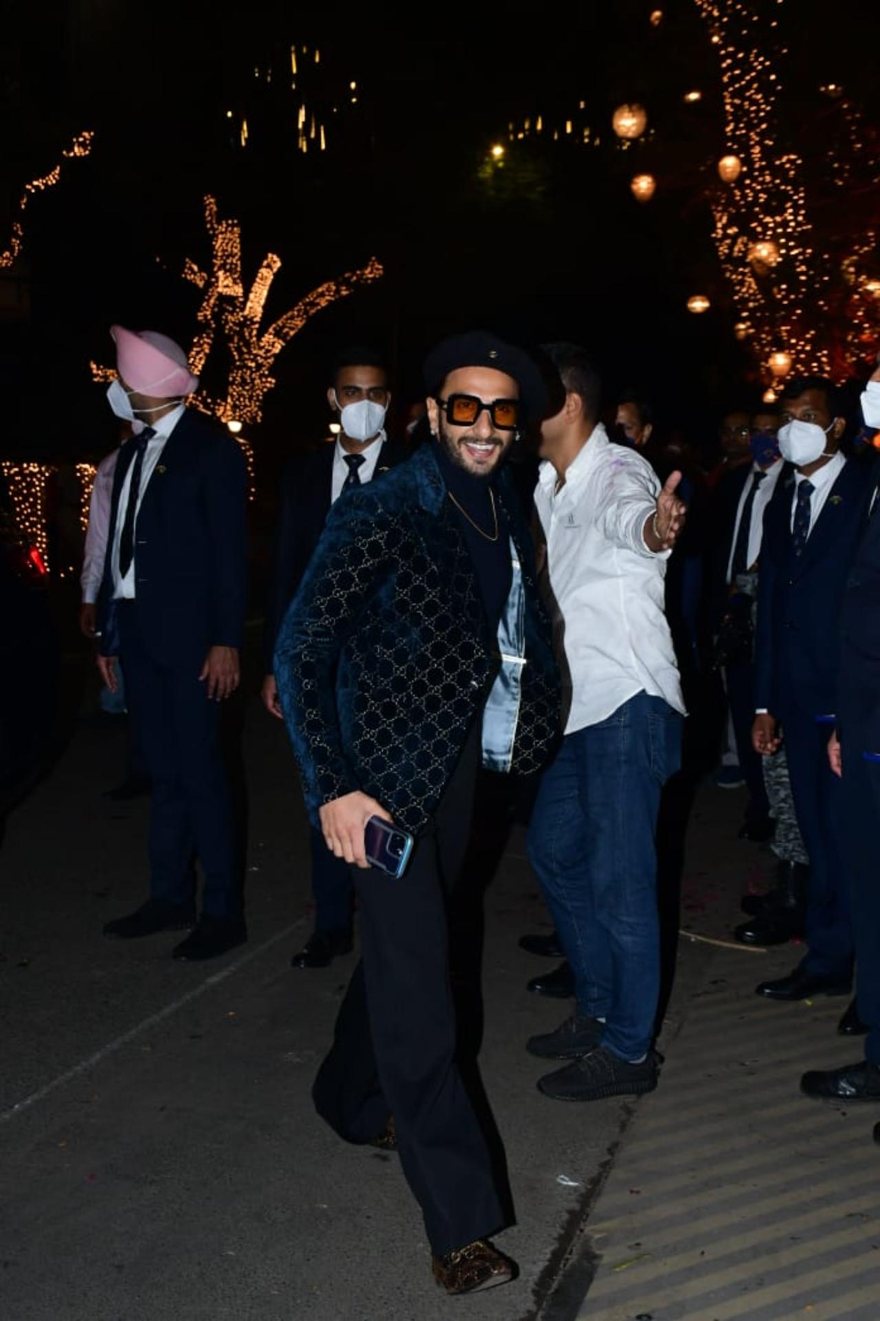 Ranveer Singh was his jolly self as he arrived for the party.  He opted for a super chic look wrapped in a blue velvet suit, as he happily waved to the photographers stationed at the event
