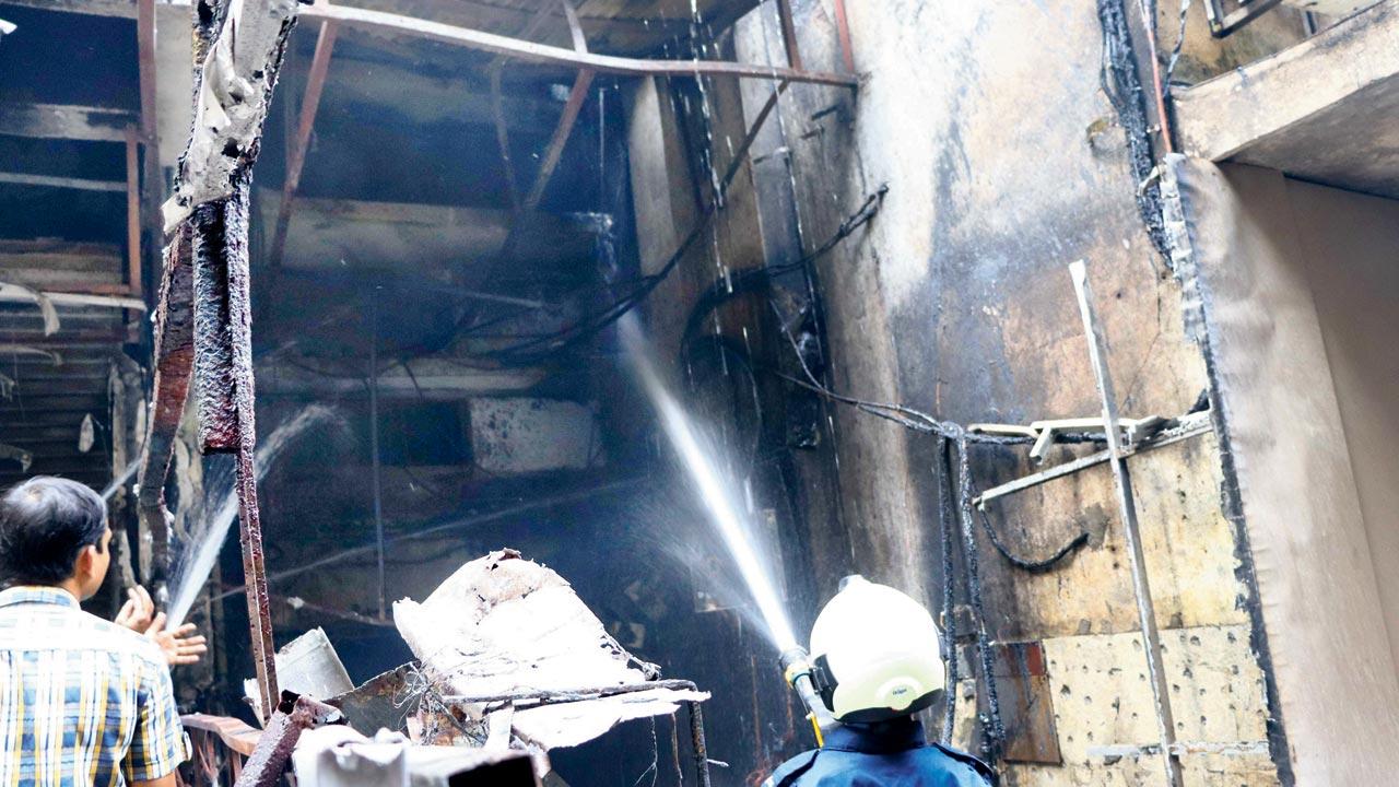Firefighters douse the blaze at a building near Parakh Hospital in Ghatkopar East on December 17	