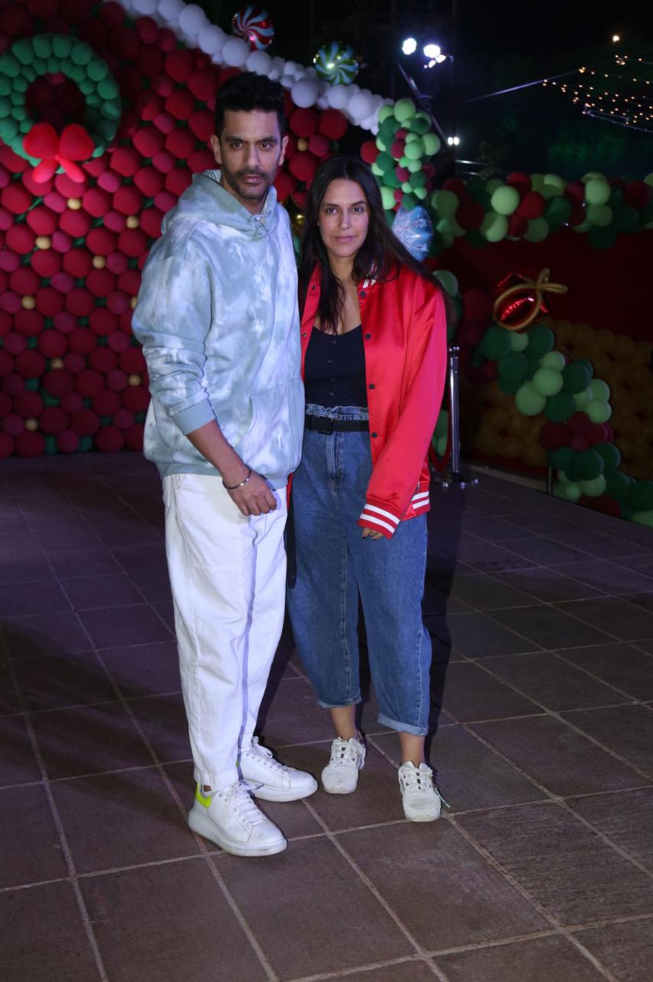 Bollywood couple Angad Bedi and Neha Dhupia arrived at the party in casual outfits. Angad opted for a blue hoodie, whereas Neha donned a red varsity jacket over a black top
