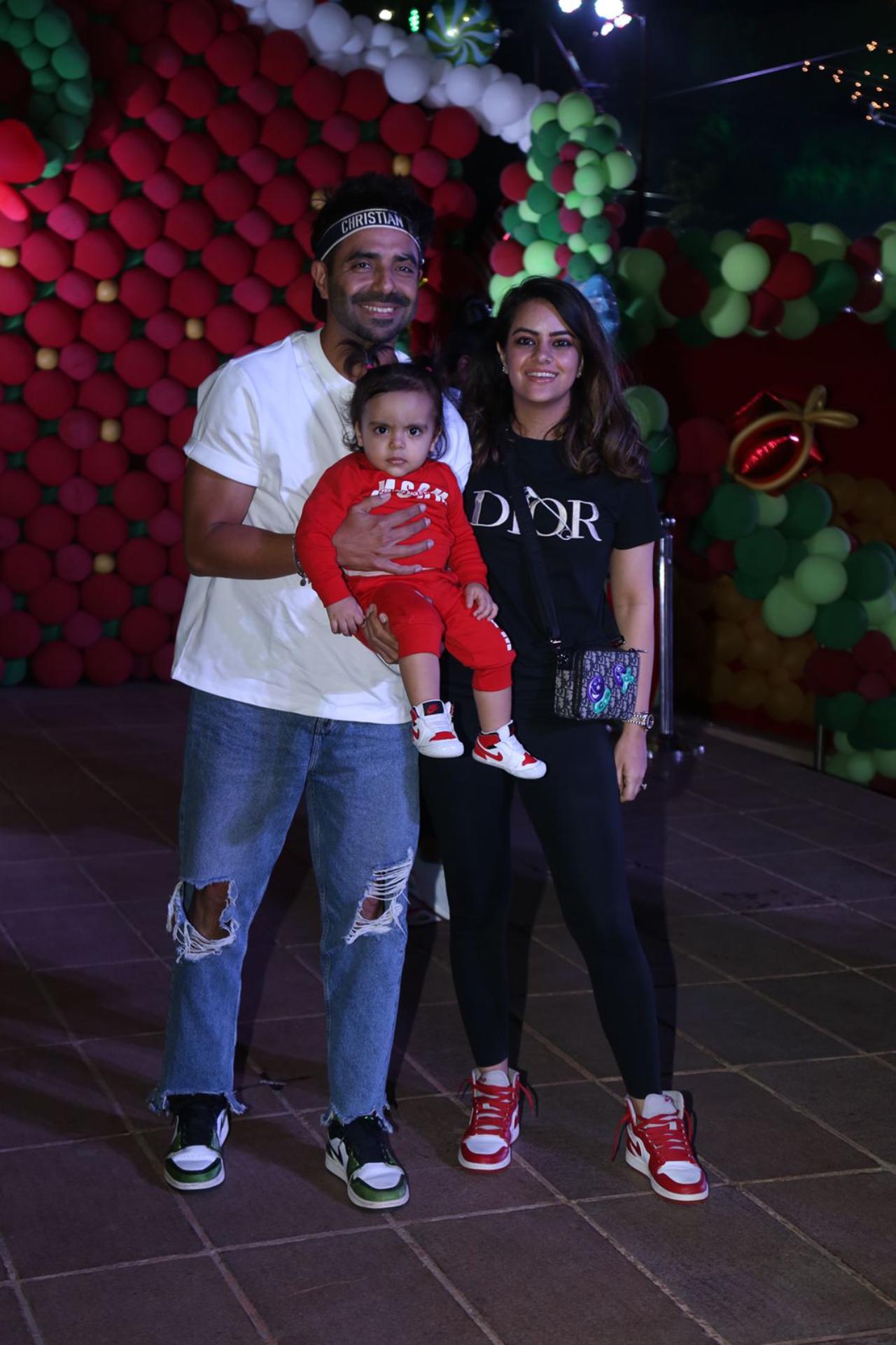 Aparshakti Khurana arrived with his wife Aakriti Ahuja and daughter Arzoie. He opted for a white t-shirt and shredded blue jeans