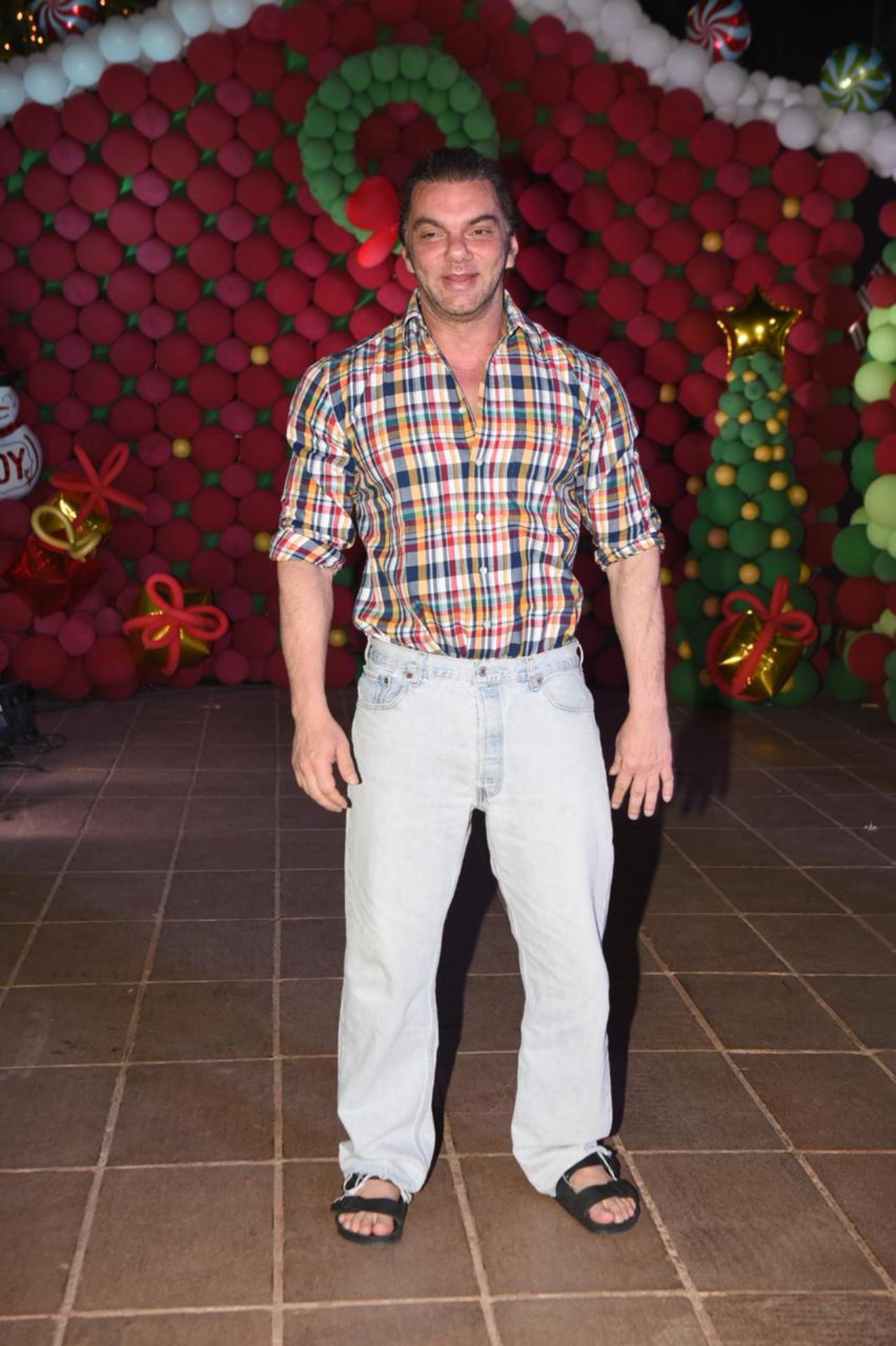Actor and producer Sohail Khan opted for a yellow checked shirt with blue jeans and was seen interacting with the paps