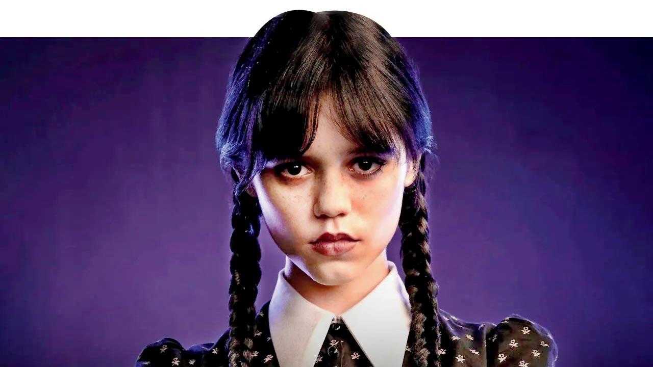 Jenna Ortega as Wednesday Addams wearing a tapered slim and pointy collar