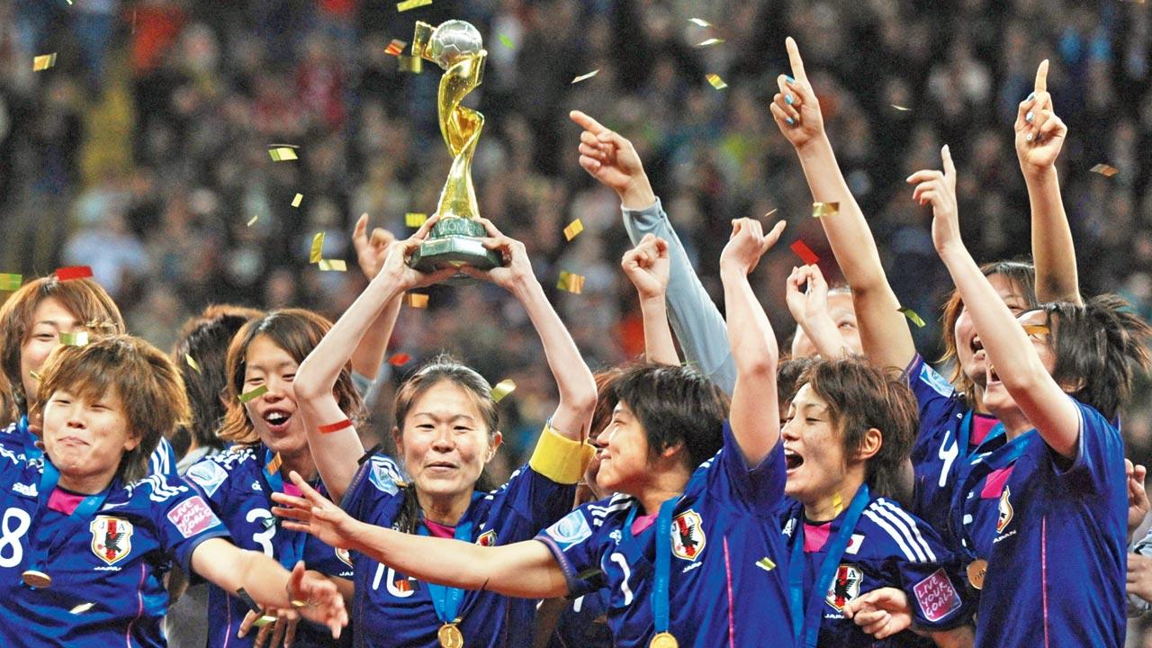 Japan’s women team celebrate after winning the 2011 FIFA WC in Germany