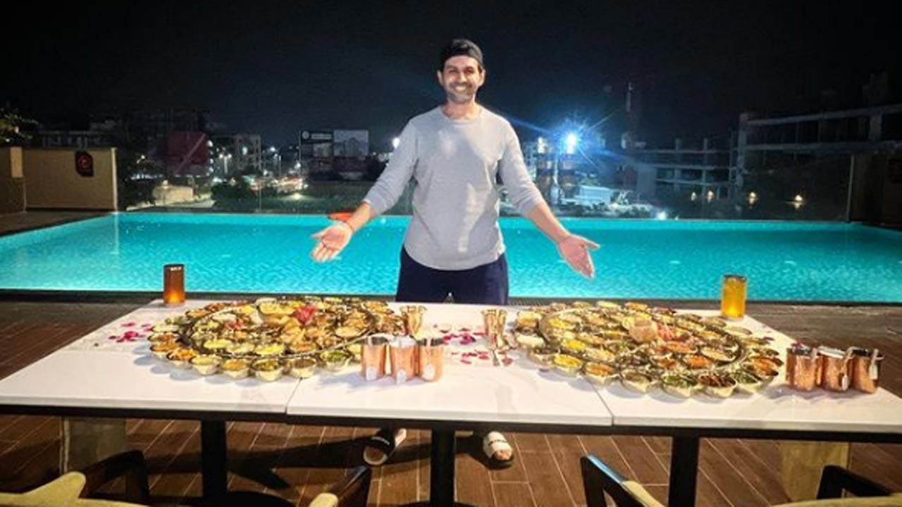 No touching, only seeing: Kartik Aaryan poses with huge Gujarati thalis