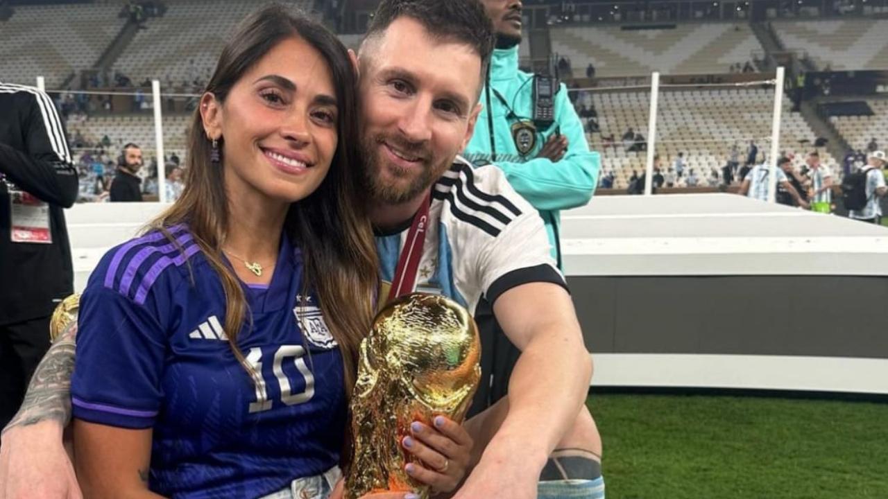 Antonela Roccuzzo and Lionel Messi with the trophy