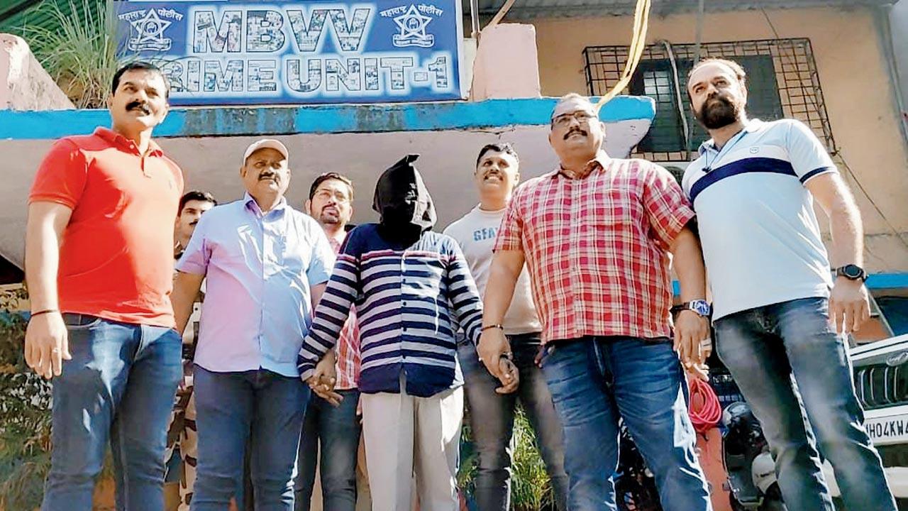 MBVV crime branch unit 1 officers with arrested accused Rajkumar Amarnath Chauhan. Pic/Hanif Patel