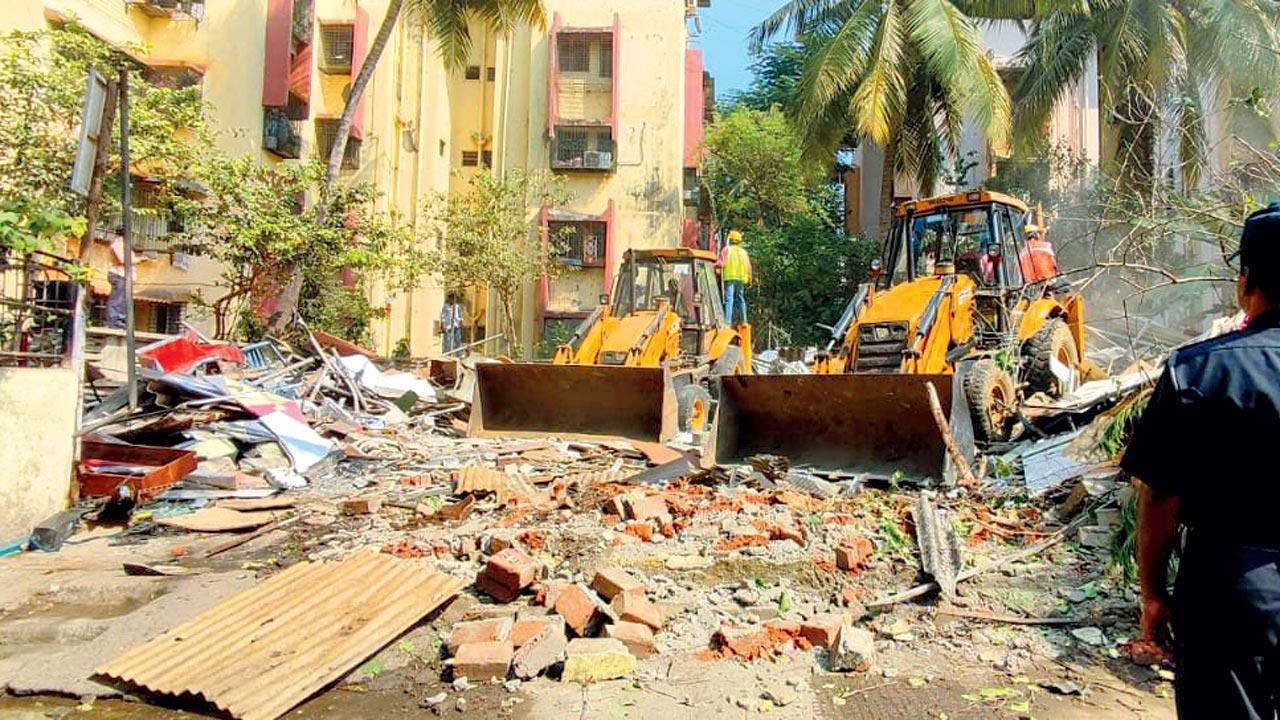 Workers demolish Bethel Gospel Pentecostal Church in Seawoods on Friday. Pic/Sumit Renose