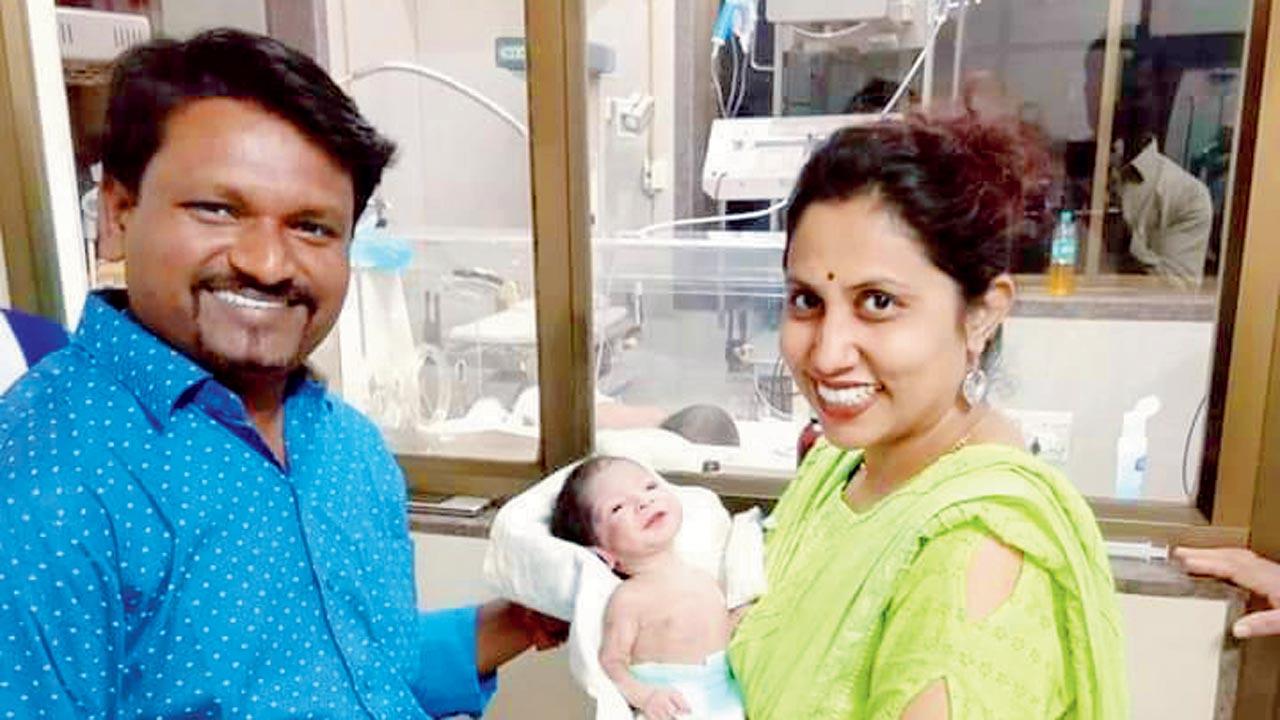 Shivaji and Jayashree Ragade with baby Tiger. File pic
