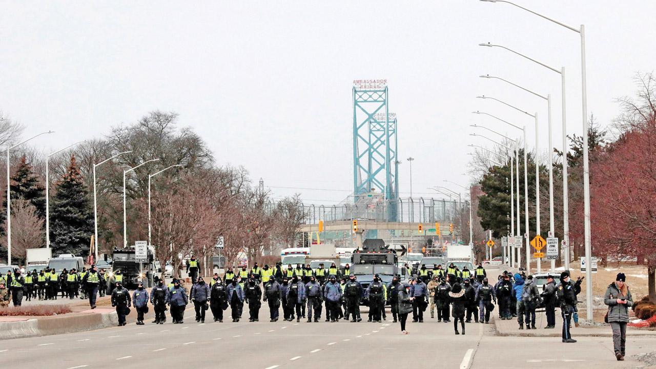 Key US-Canada bridge reopens, Ottawa protest on