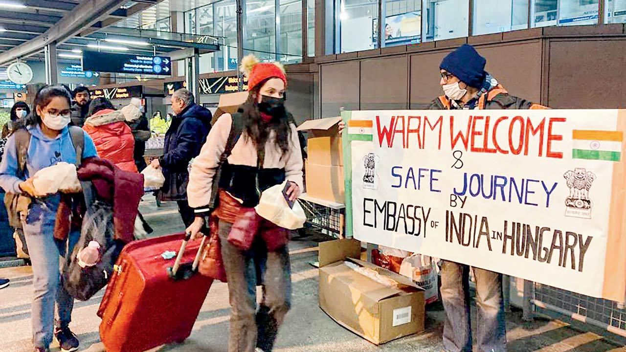 Indian nationals on way to board a special AI flight, evacuating Indians from Ukraine, in Budapest. Pic/PTI