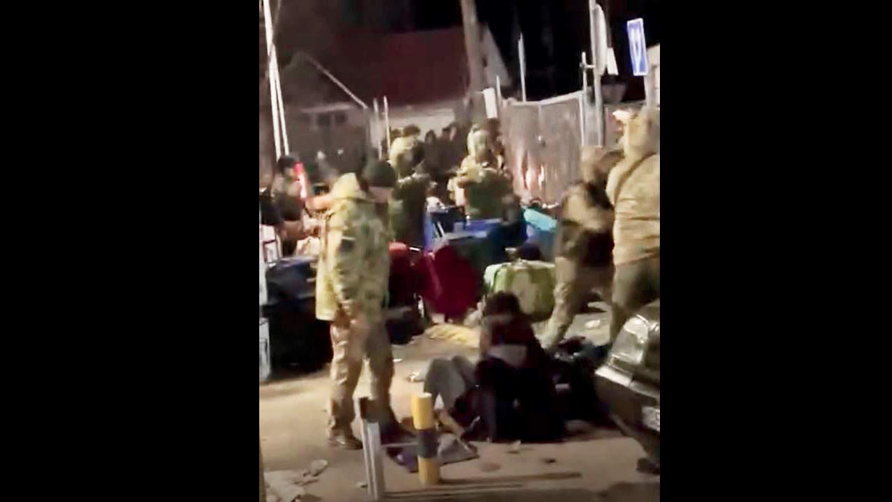 Screen grabs showing soldiers pushing students 