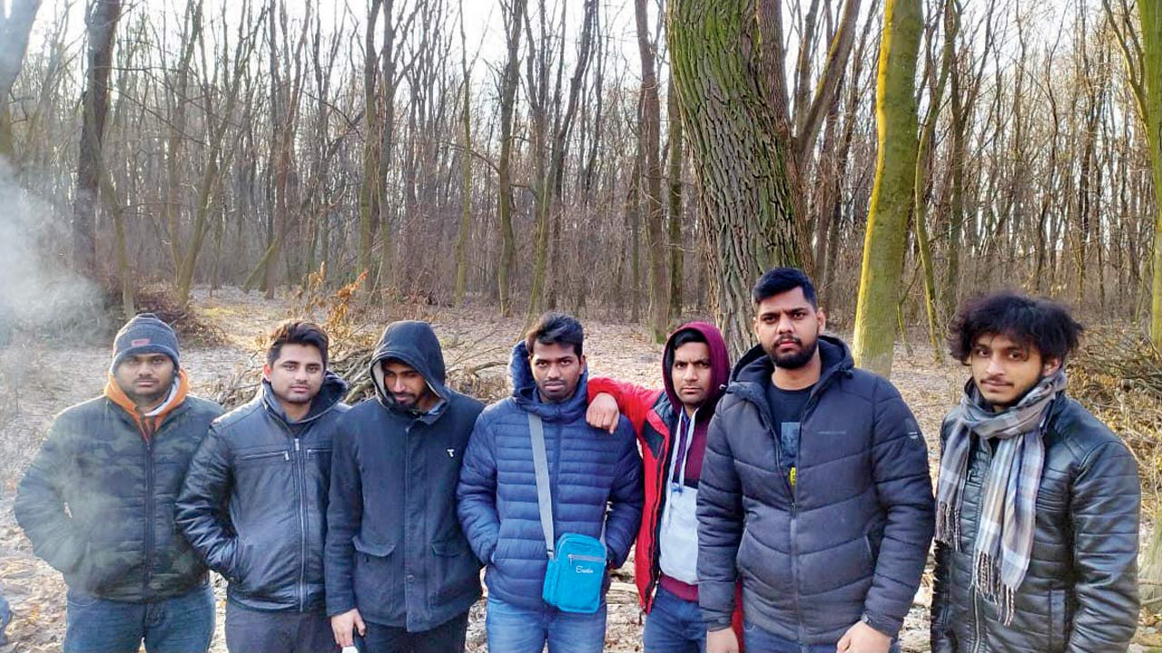 Indian students waiting to cross over to Poland at the Sahiniy Medyka border
