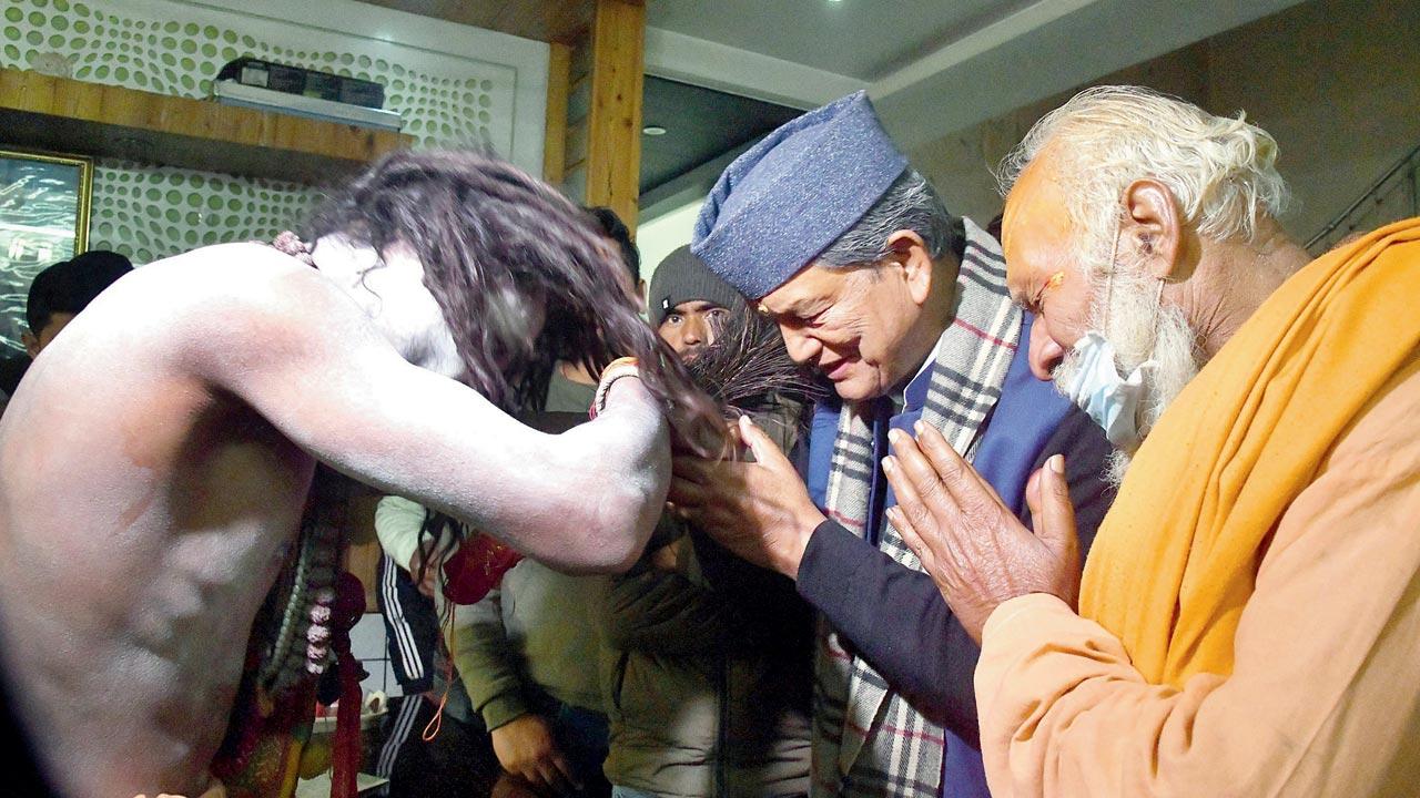 Meanwhile, former Uttarakhand CM Harish Rawat seeks blessings from a ‘Naga sadhu’, in Nainital on Monday. Pic/ANI