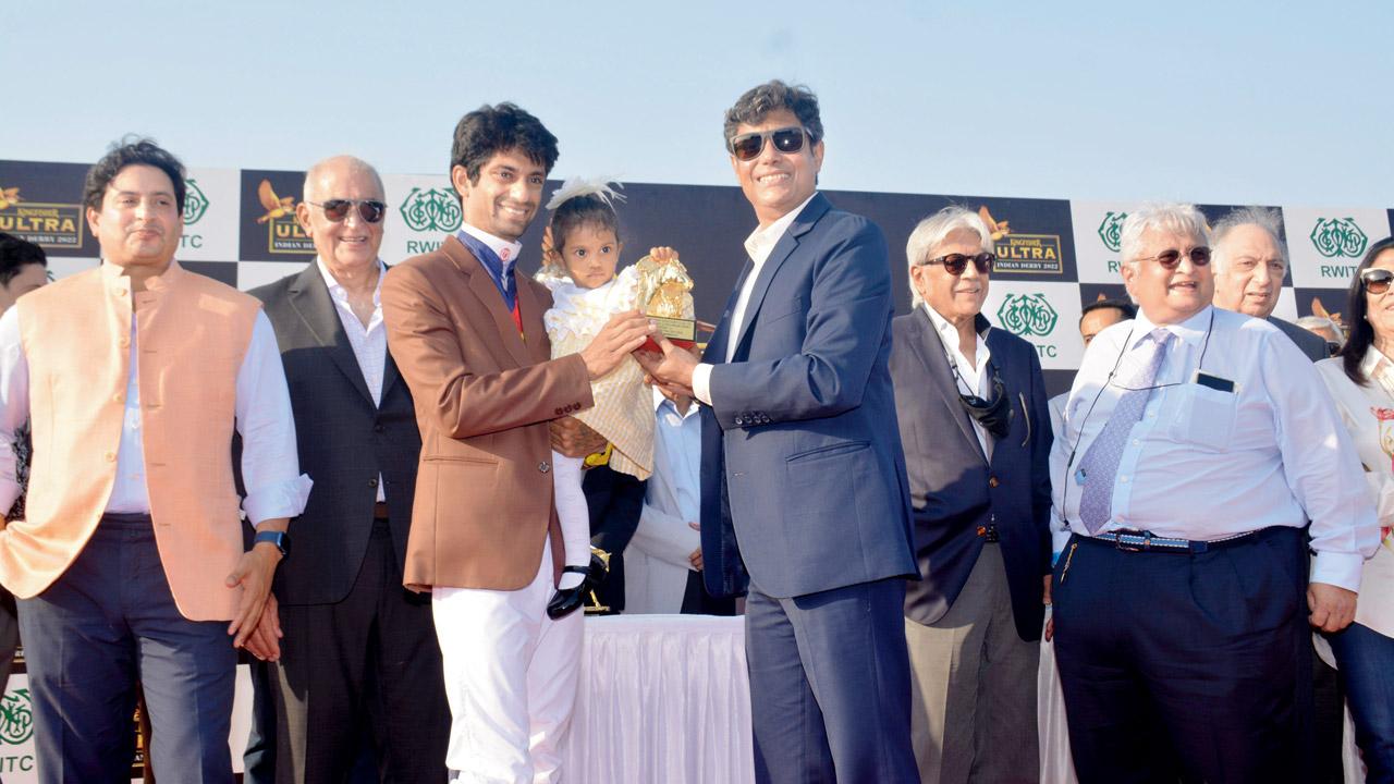 Trevor with his daughter at the prize distribution. Pic/RWITC