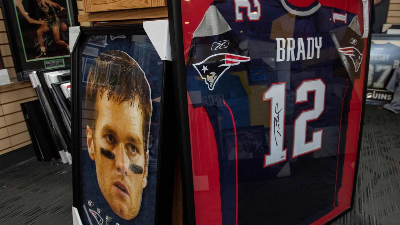 Tom Brady posters decorate the sports memorabilia shop Sportsworld in Saugus, Massachusetts on February 1, 2022
