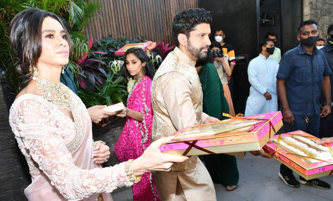 Farhan Akhtar and Shibani Dandekar distributed sweets to media at their residence after their wedding. The couple tied the knot in a stylish ceremony on February 19 at Javed Akhtar's farmhouse in Khandala.