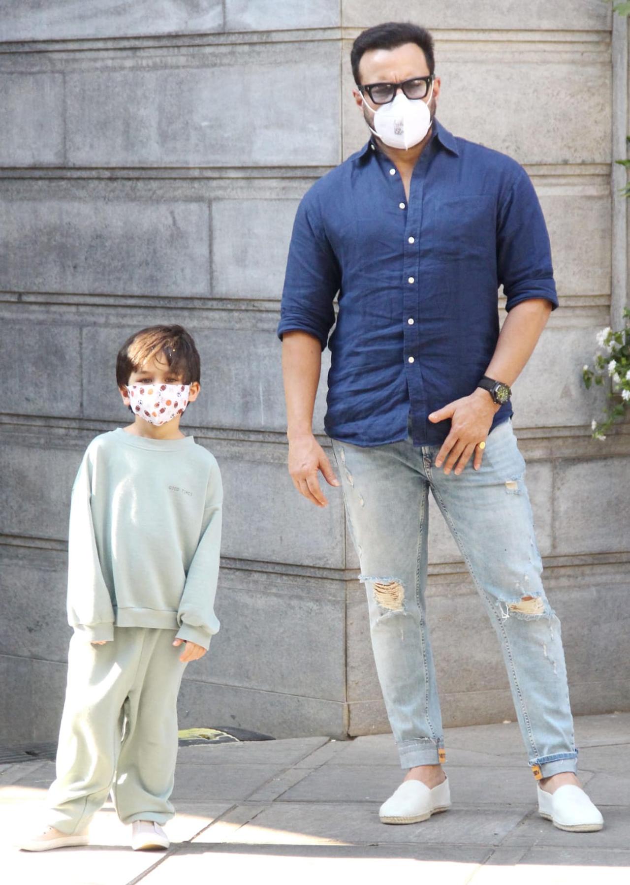 Taimur Ali Khan and Saif Ali Khan posed for the shutterbugs when snapped at the bash.