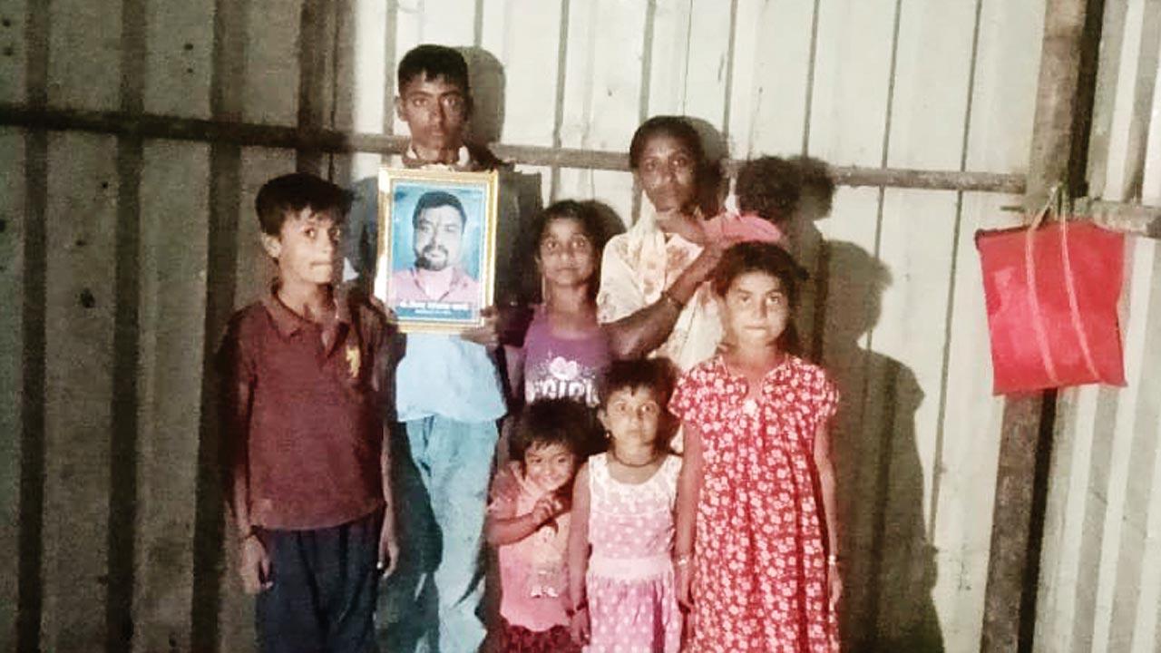 Bhima Kale’s wife Swati and their seven children at their home in Solapur district