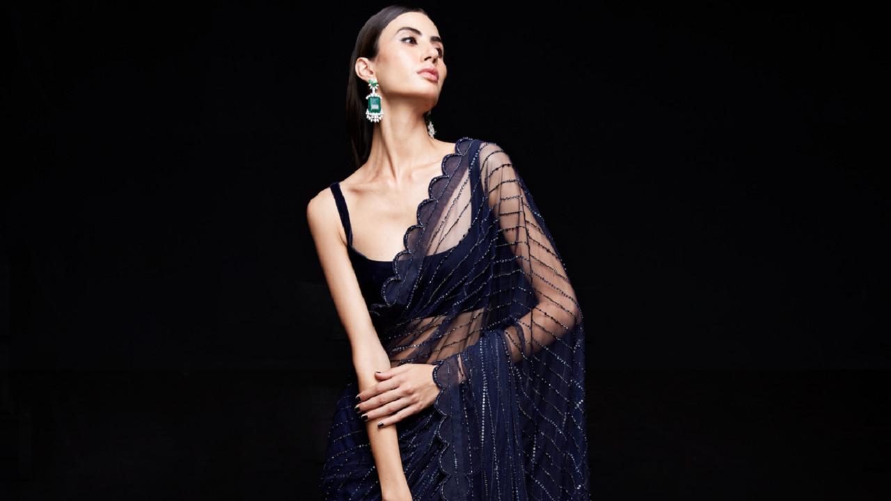 JET BLACK PLEATED COCKTAIL GOWN SET WITH A ONE SHOULDER PRINTED DRAPE AND  AN EMBROIDERED BELT AND NECKLINE. - Seasons India