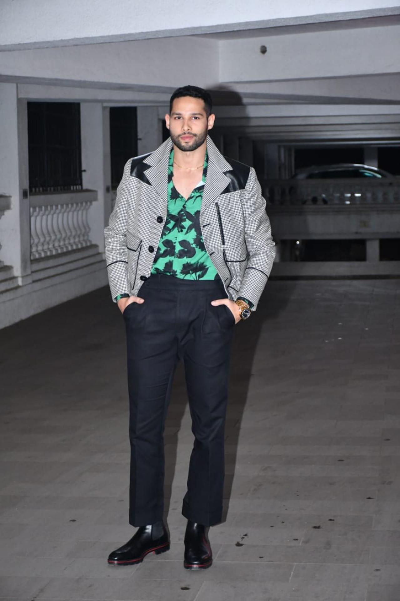 Gehraiyaan actor Siddhant Chaturvedi showed off his uber-cool side in a printed shirt, paired with a grey coat and black trousers for the celebration.