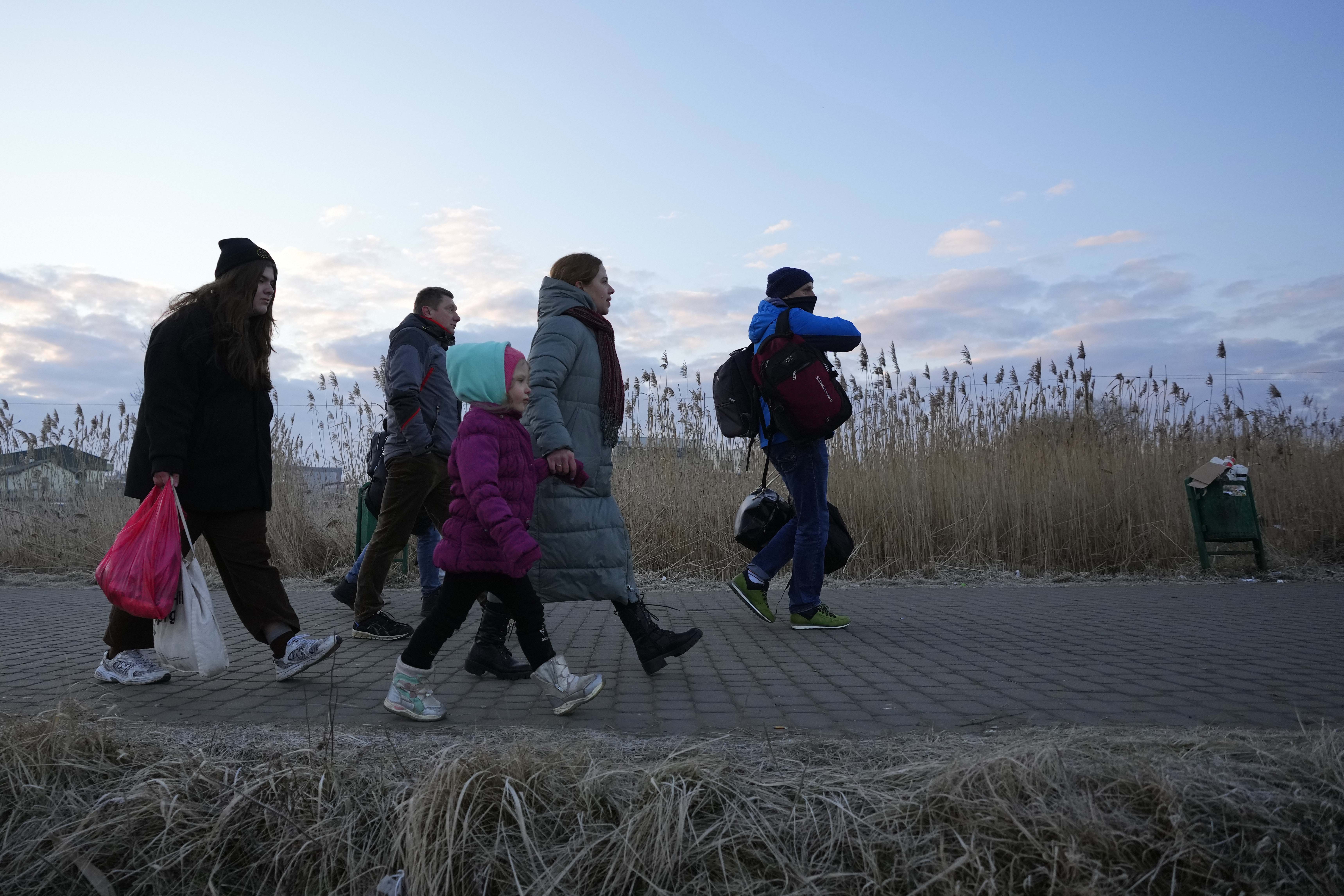 Refugees fleeing conflict in Ukraine arrive to Przemysl, Poland, Feb. 27, 2022. Pic/PTI