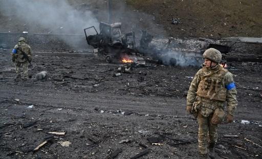 A Ukrainian soldier walks through debris on the west side of the Ukrainian capital of Kyiv. Pic/AFP