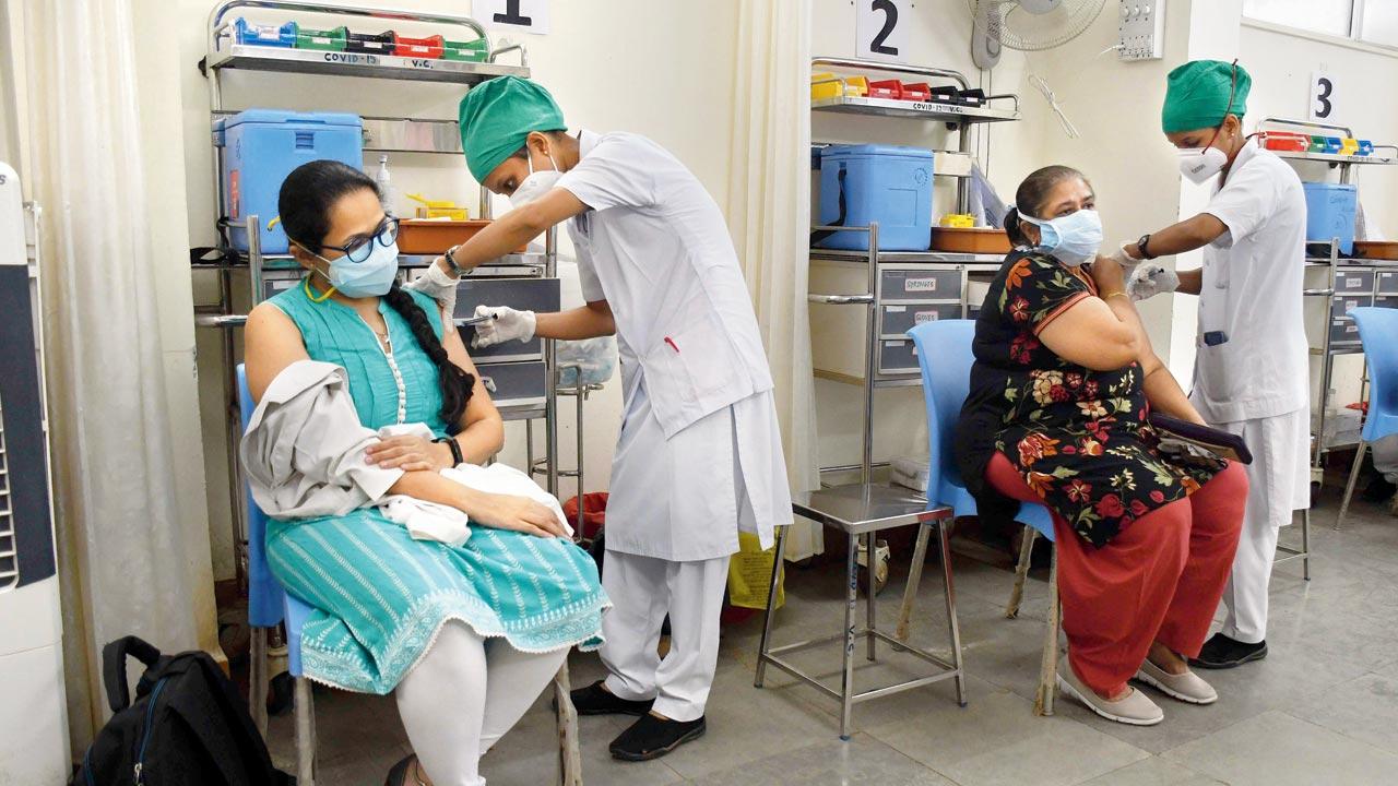 Beneficiaries get a dose of vaccine at Nair hospital. FILE PIC