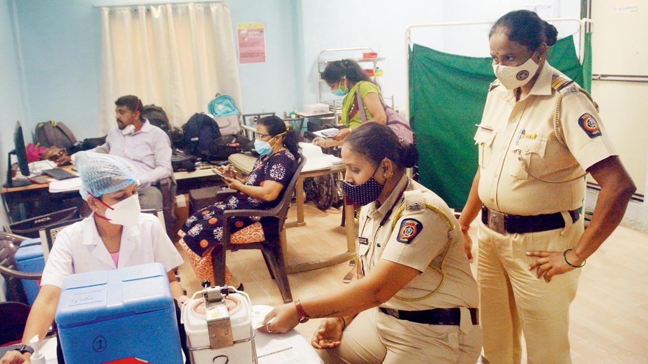 Cop Shilpa Sarate at Rajawadi Hospital, in Ghatkopar, to take her booster dose, on Monday