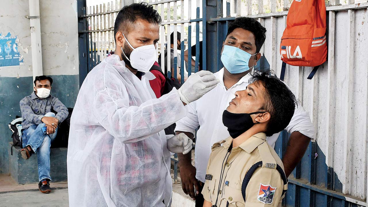 A sample being collected from a railway cop, at Dadar station. Pic/Ashish Raje