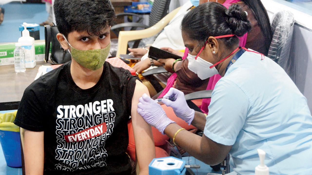 A teenager gets a vaccine shot at the COVID Health Centre, Kanjurmarg East, on Monday. Pic/Satej Shinde