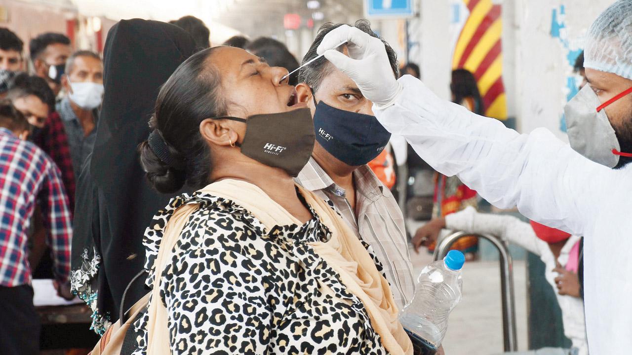 A woman undergoes a rapid antigen test for Covid-19, at Dadar station, on Thursday. Pic/Ashish Raje