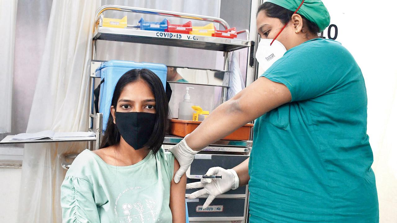 A genuine beneficiary being administered a vaccine dose at Nair hospital on Thursday. Pic/Ashish Raje