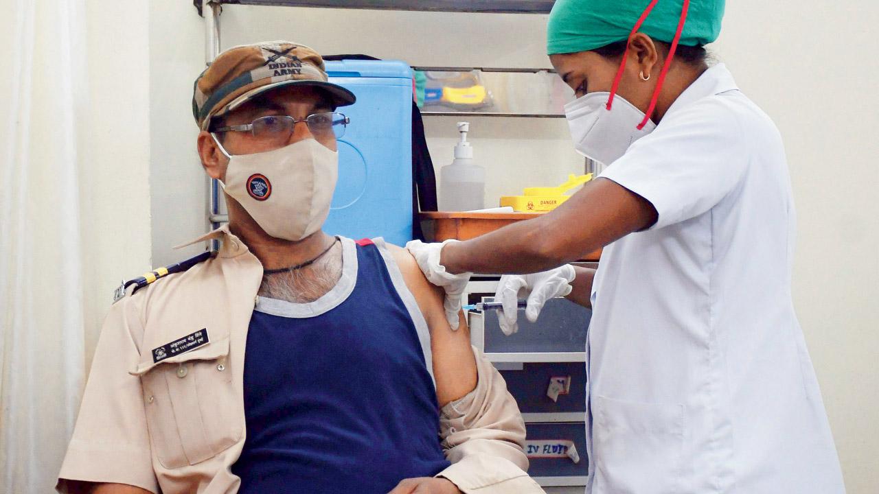 A policeman takes a booster dose at Nair hospital on Wednesday. Pic/Ashish Raje
