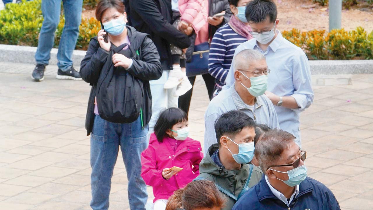 Locals line up to get tested for coronavirus at a temporary testing centre for Covid-19 in Hong Kong on Sunday. Pics/AP