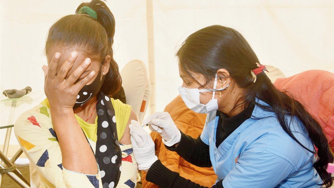 A teenager receives a vaccine dose, in Patna on Friday. Pic/PTI