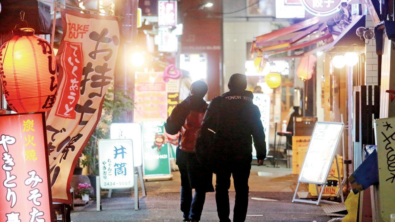 Japan widens restrictions as omicron surges in cities