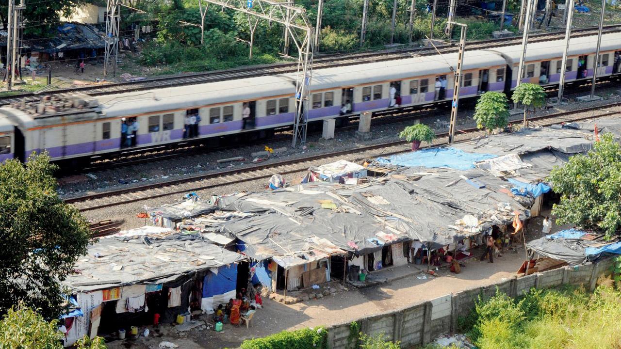 Slums near railway tracks between Malad and Kandivli stations. File pic