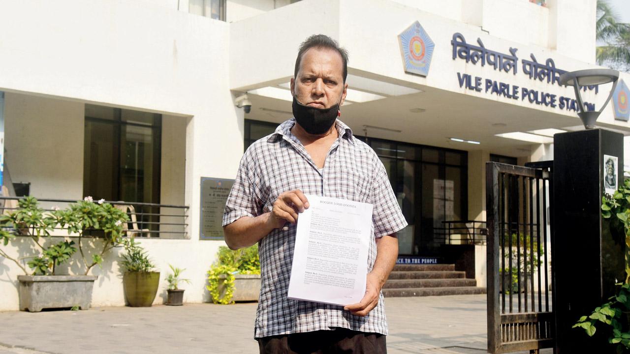 Roque D’Souza with his complaint letter outside Vile Parle police station