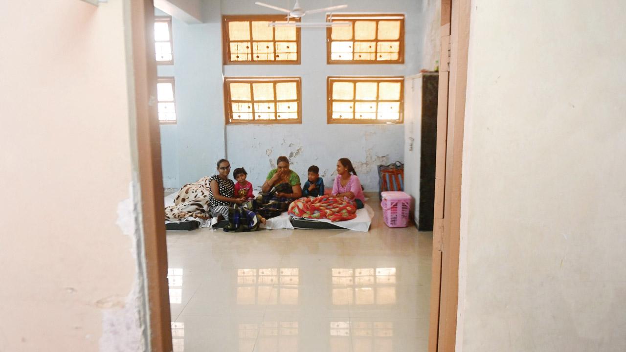 Survivors of Sachinam Heights fire at the BMC school in Grant Road on Tuesday. Pic/Bipin Kokate