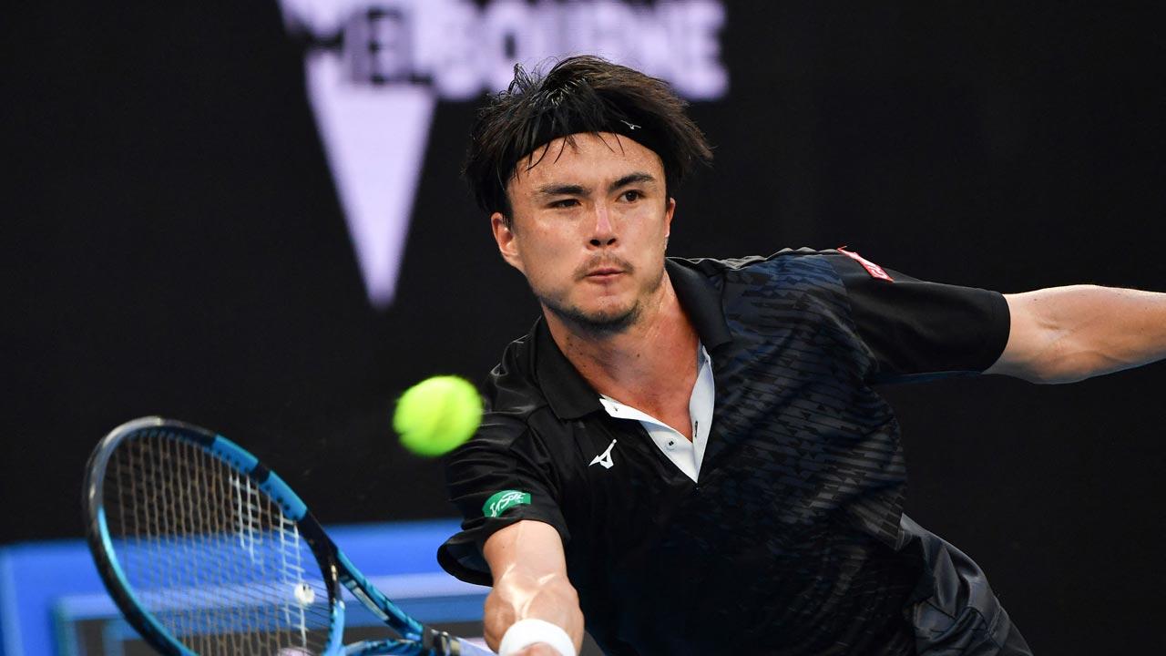 Japan`s Taro Daniel hits a return against Britain`s Andy Murray during their men`s singles match on day four of the Australian Open tennis tournament in Melbourne. Pic/AFP