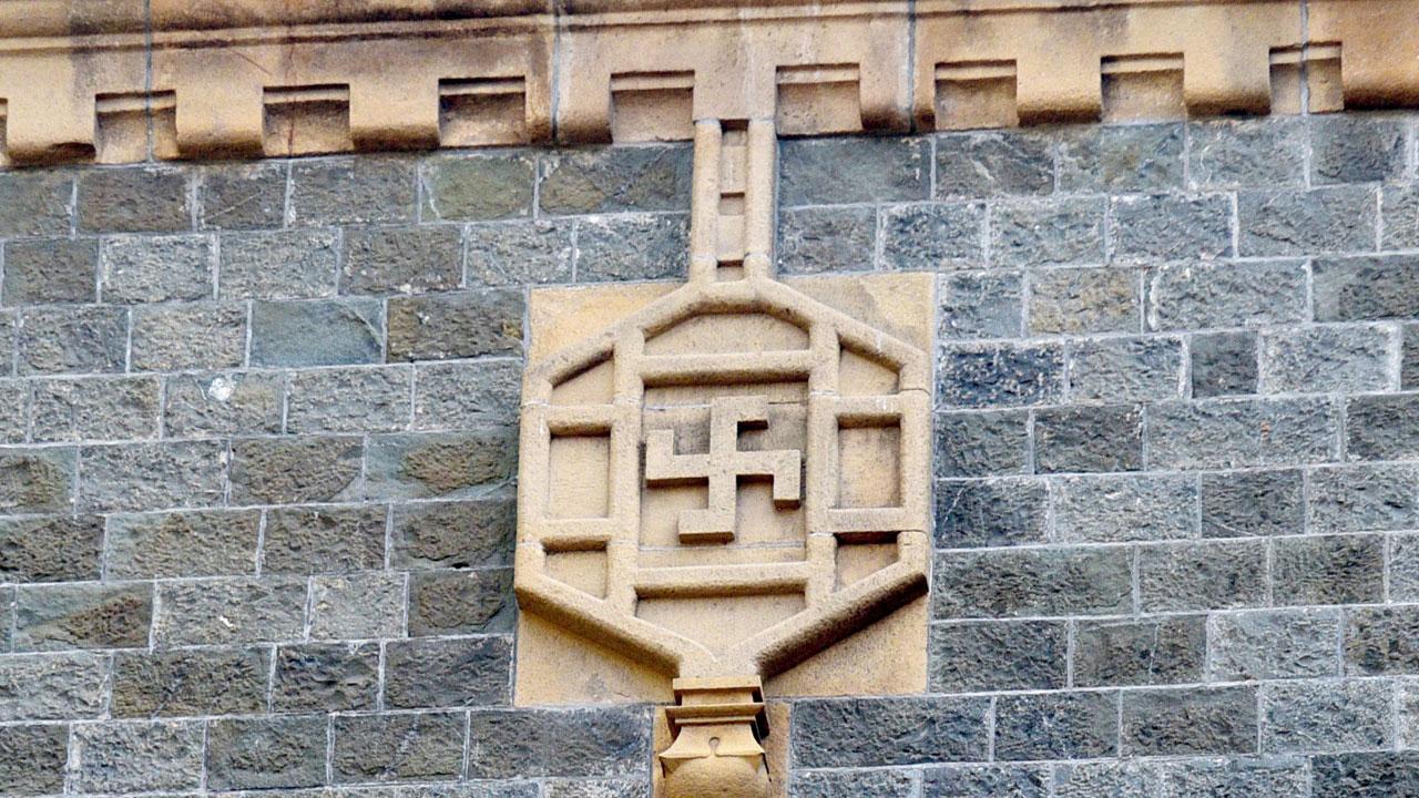 Motifs like the swastika (reverse and straight) and trident (trishul) created by craftsmen on the back façade, enhance the Indo Saracenic influence