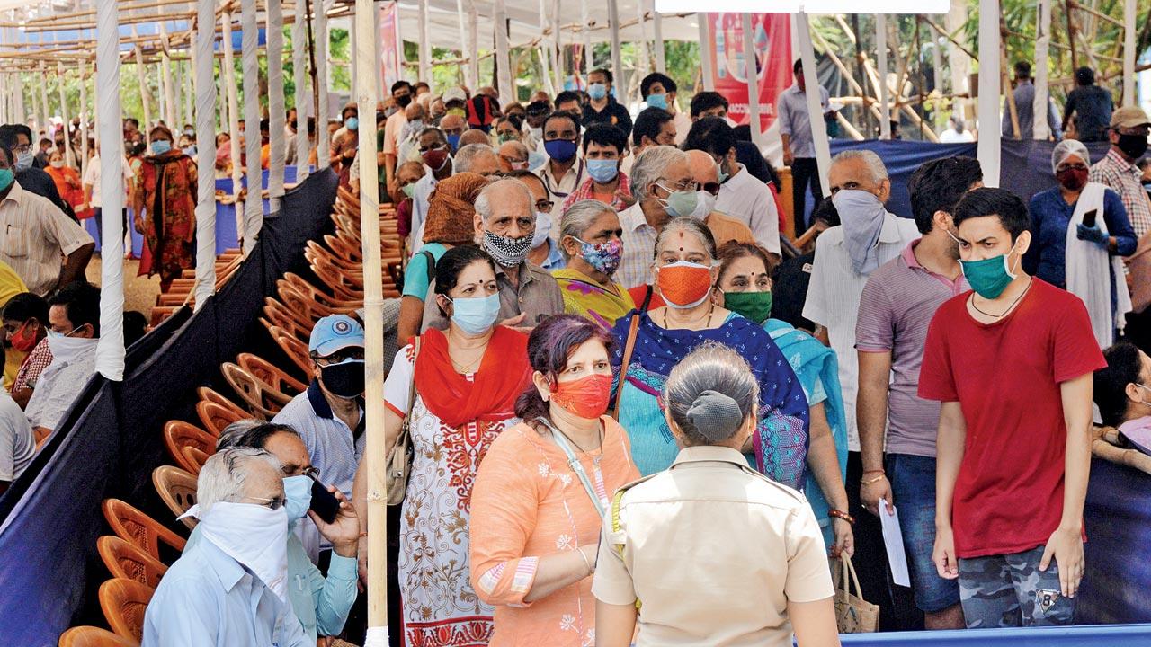 People wait to get vaccinated at NESCO centre in Goregaon. File Pic